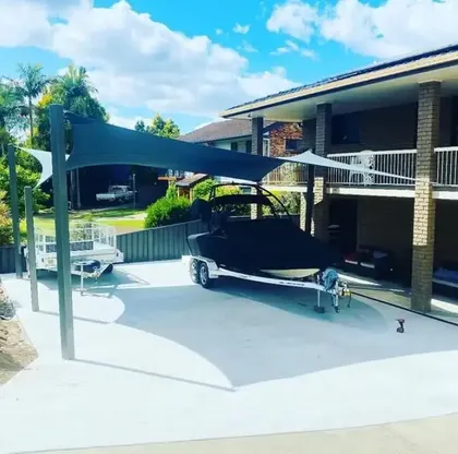 Custom boat cover and over-trailer shade structure built by North Coast Shade in Ballina