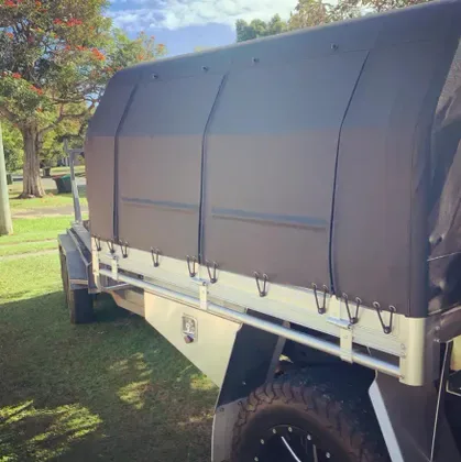 Custom shade cover over a boat at a residential property