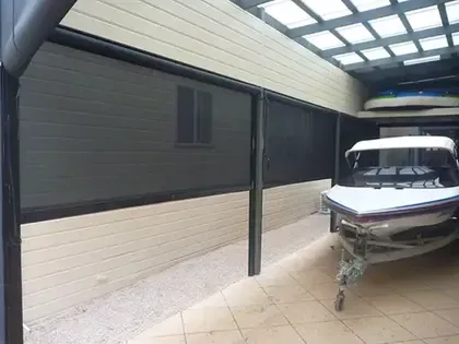 Custom canvas shade cover protecting a boat in storage