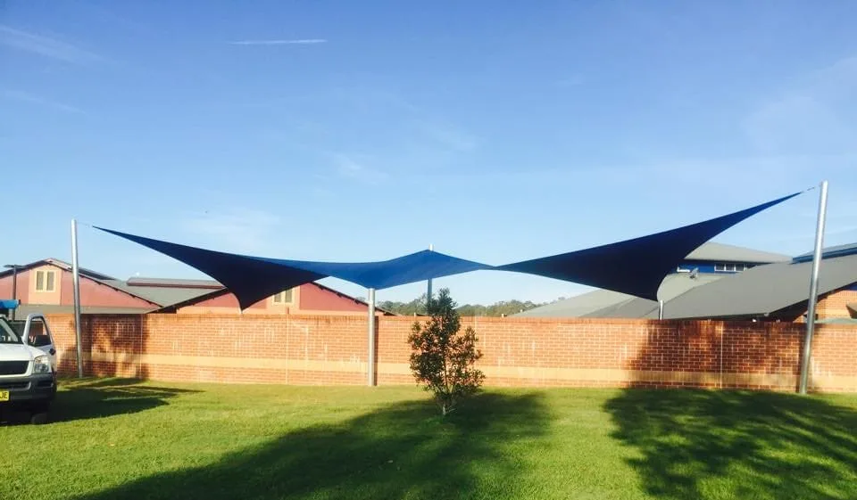 Navy shade sail over a childcare yard