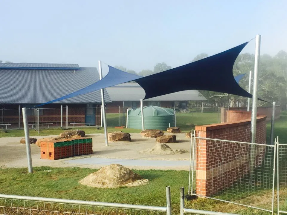 Navy shade sails over a school yard on the North Coast