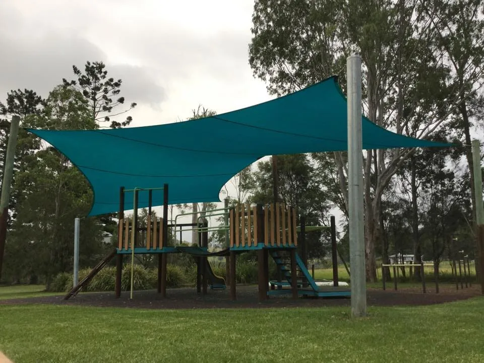 Teal shade sails over a public playground
